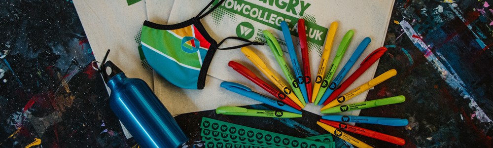 College of HoW College eco-friendly merch which includes Cotton canvas tote bag with the text Donut talk to me I'm Hangry, blue metal water bottle, green paper wristbands, HoW branded face covering, HoW branded reusable coffee cup and  red, green, blue and yellow pens