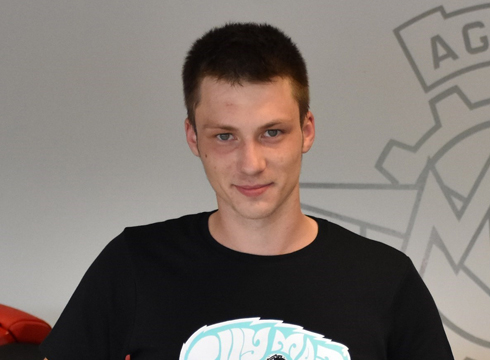 Close up photo of smiling male in black tshirt