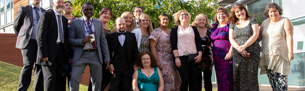 Group picture of male and female students smartly dressed for Prom