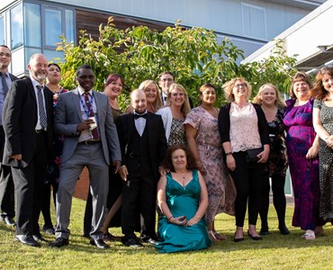 Group picture of male and female students smartly dressed for Prom