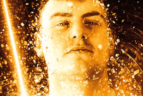 Image of male student surrounded with gold glitter. Text reads: 2021 Further Education Awards.