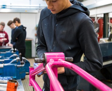Student building a bicycle