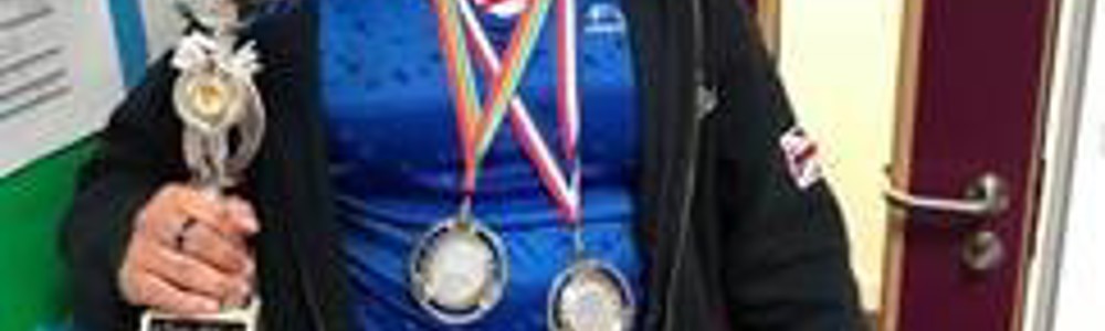 Judo winner holding medals