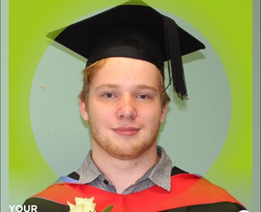 picture of Ross Davis in graduation gown and cap smiling for a picture. Background is green and says where are they now