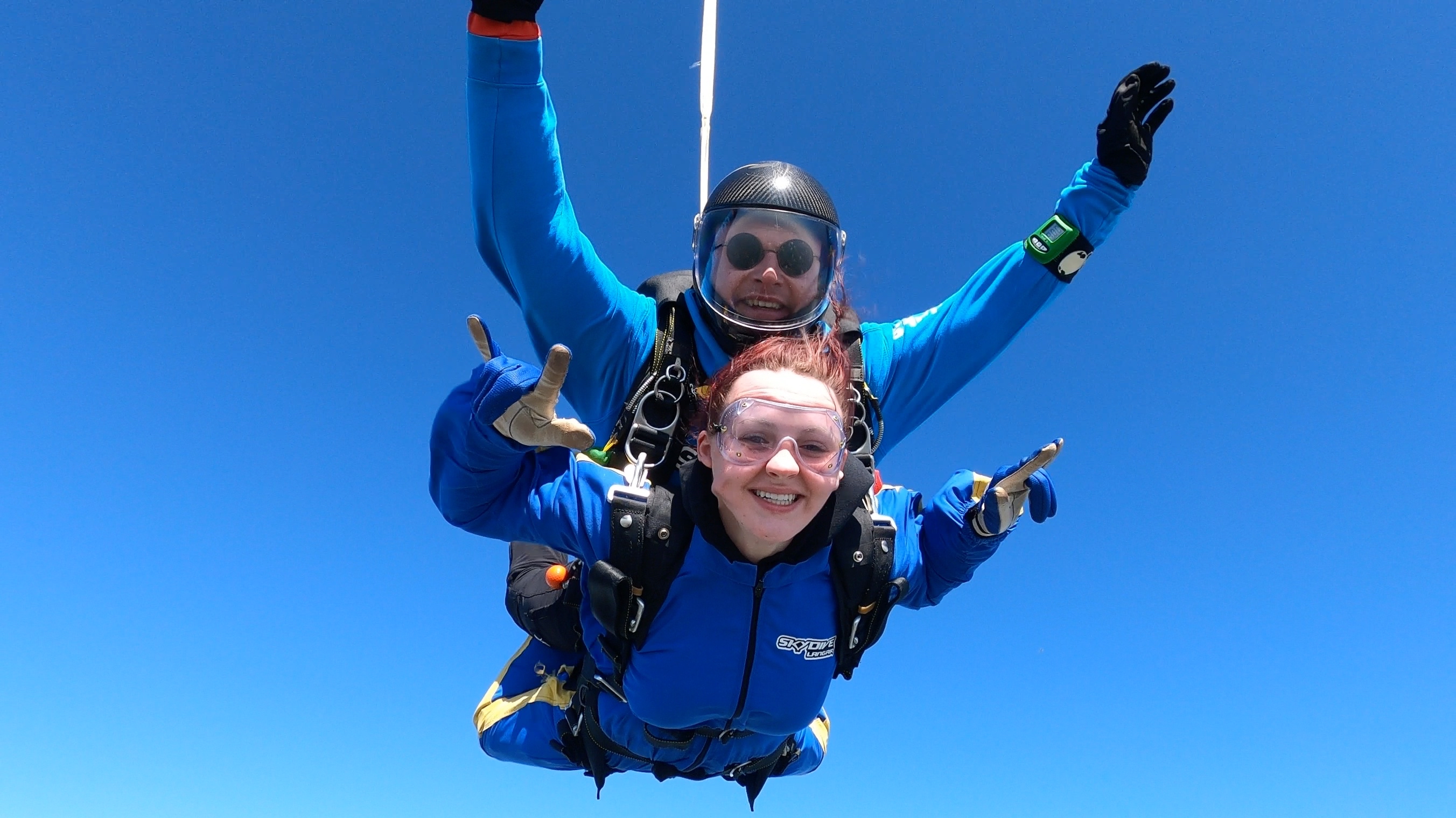HoW College student Tegan skydives with another person